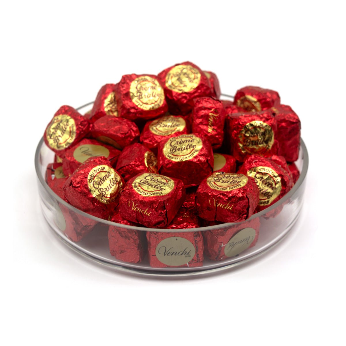 Assorted chocolates in red and gold wrappers on a white background