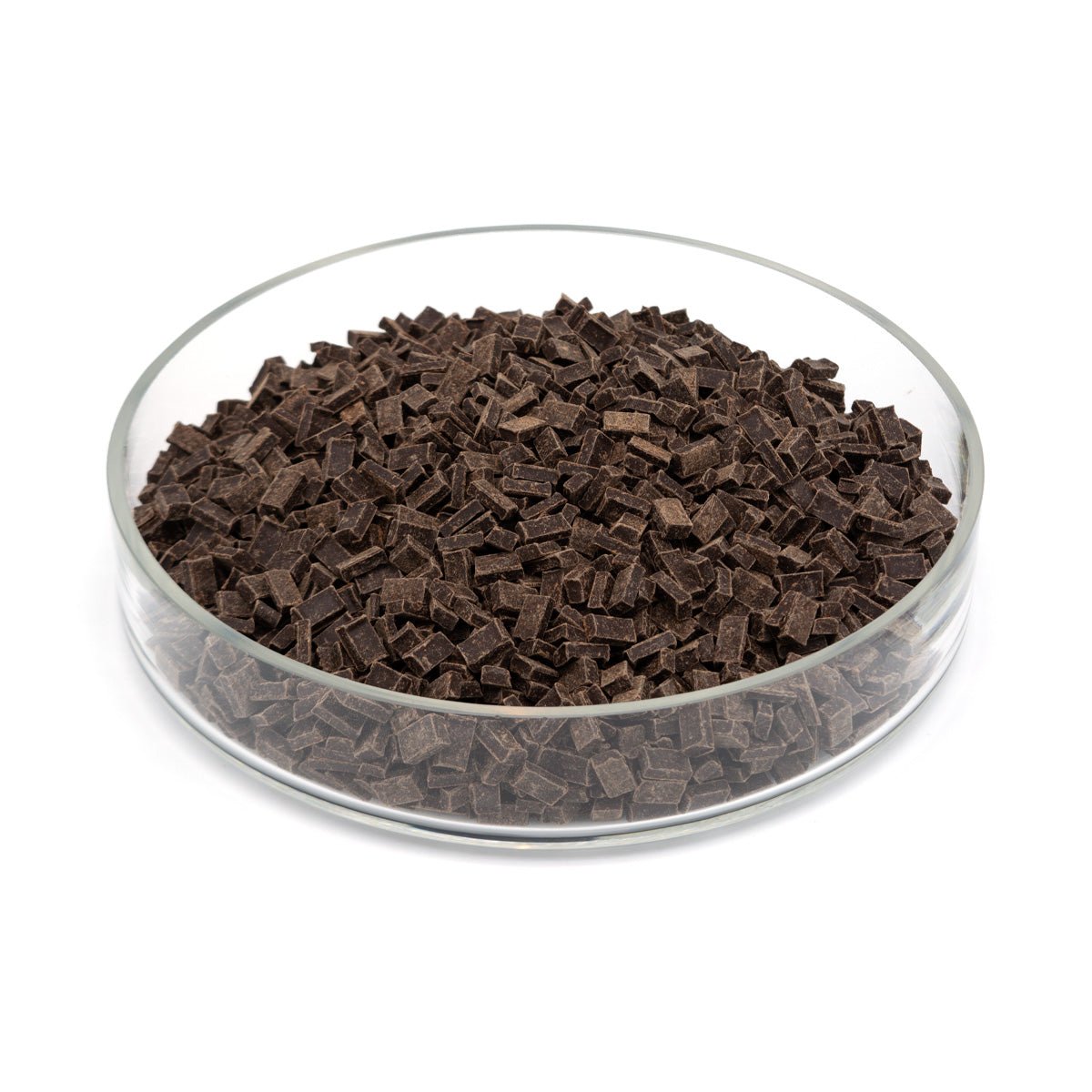 Glass bowl filled with dark chocolate pieces on a white background
