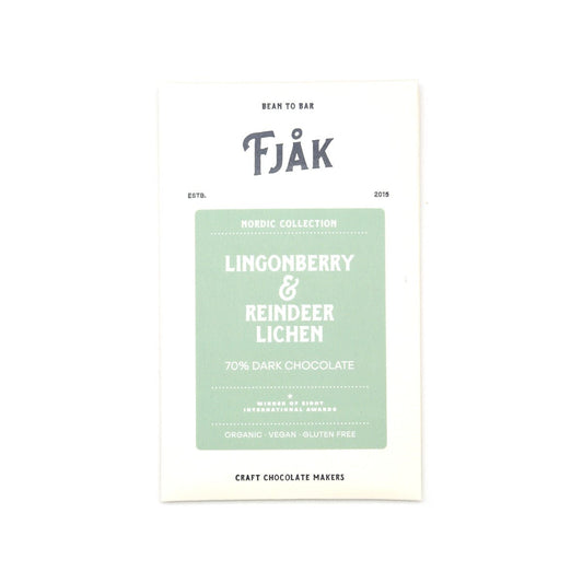 A vertical white chocolate bar packaging card for Fjåk Nordic Collection Lingonberry & Reindeer Lichen 70% Dark Chocolate, featuring a light sage green central label on a white background.