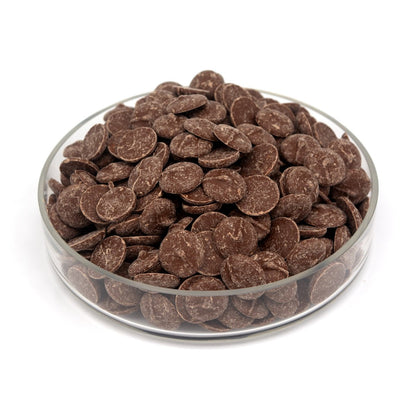 Glass bowl filled with chocolate wafers on a white background