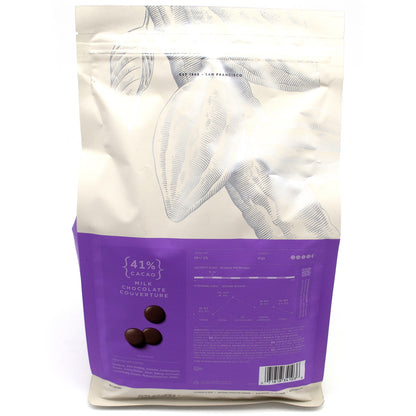 A 3 kg stand-up pouch of 41% Cacao Milk Chocolate Couverture, featuring a white upper section with a line-art cocoa bean illustration and a purple lower section displaying the brand and product details.