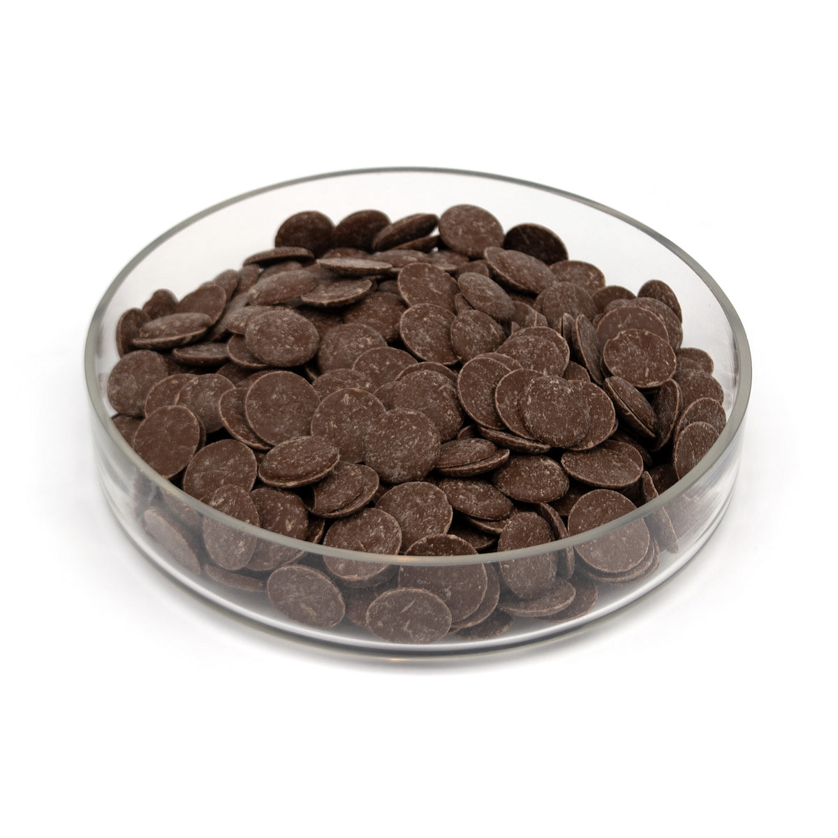 Glass bowl half filled with chocolate wafers on a white background