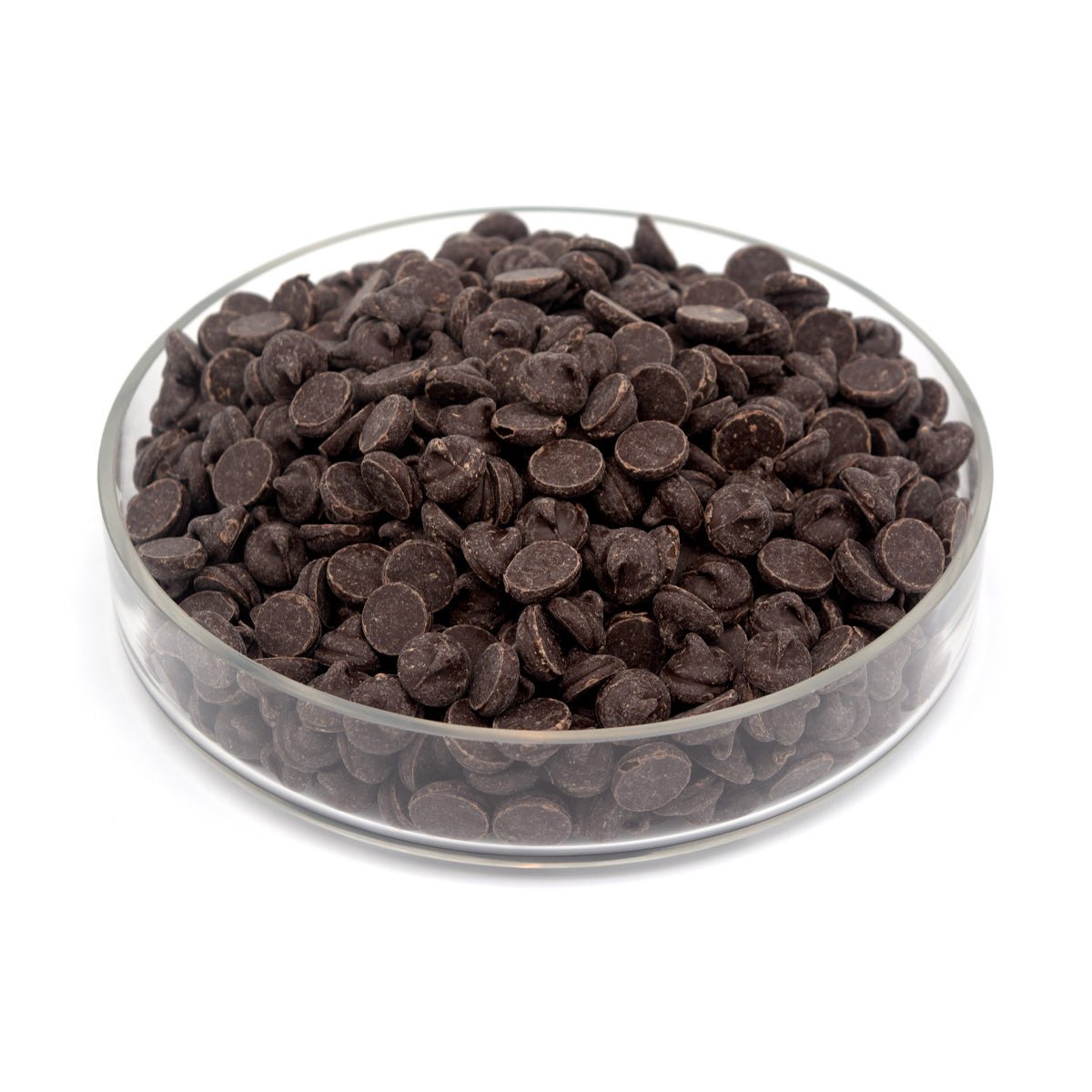 Glass bowl filled with large dark chocolate chips on a white background
