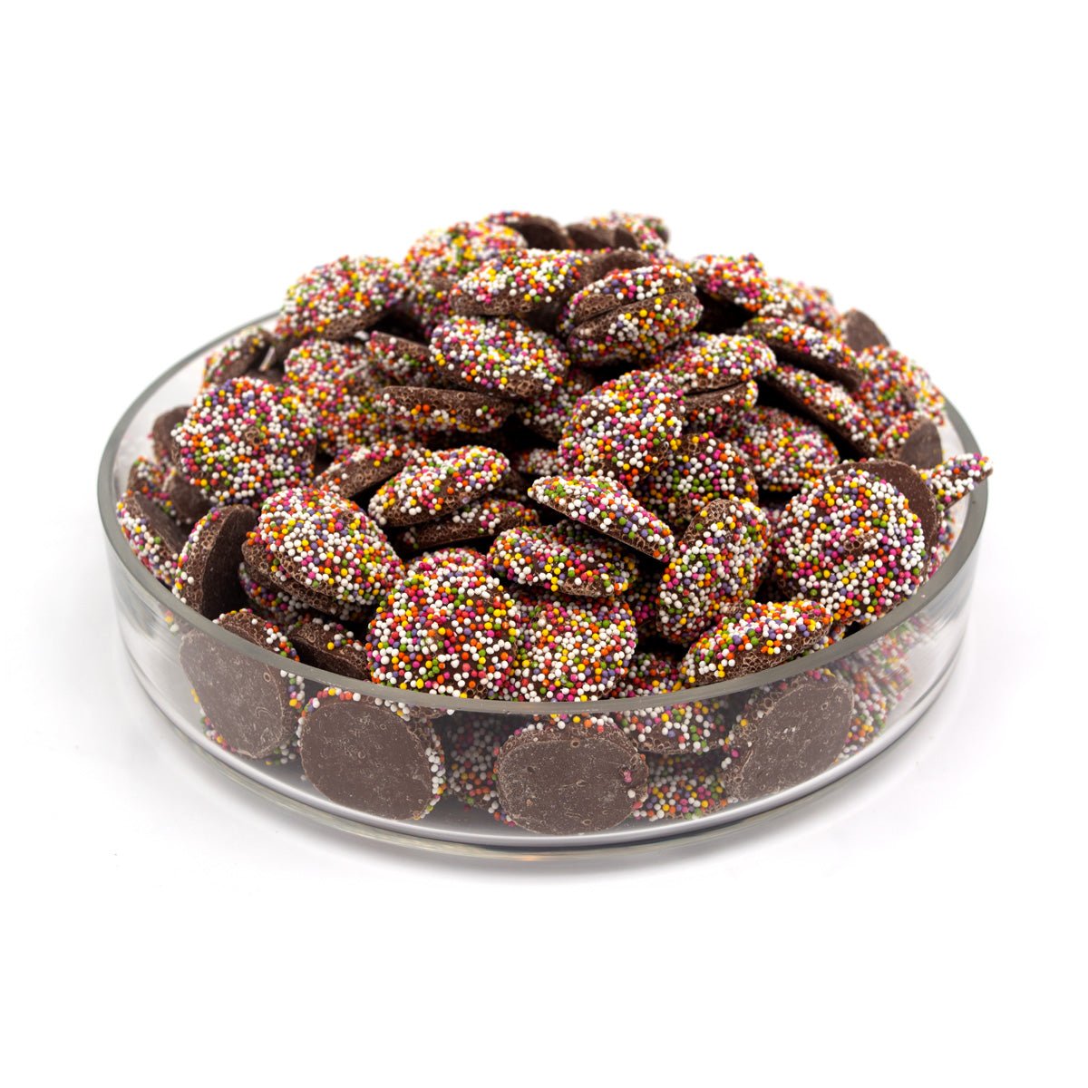 Glass bowl filled with chocolate covered wafers with colorful sprinkles on a white background