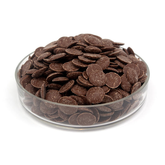 Glass bowl filled with chocolate wafers on a white background