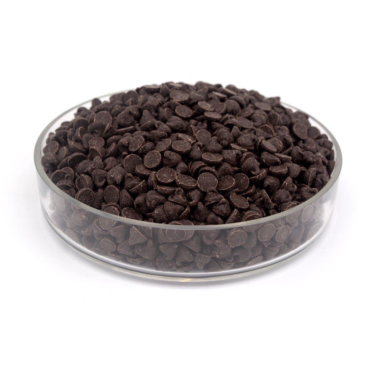 Glass bowl filled with dark chocolate chips on a white background
