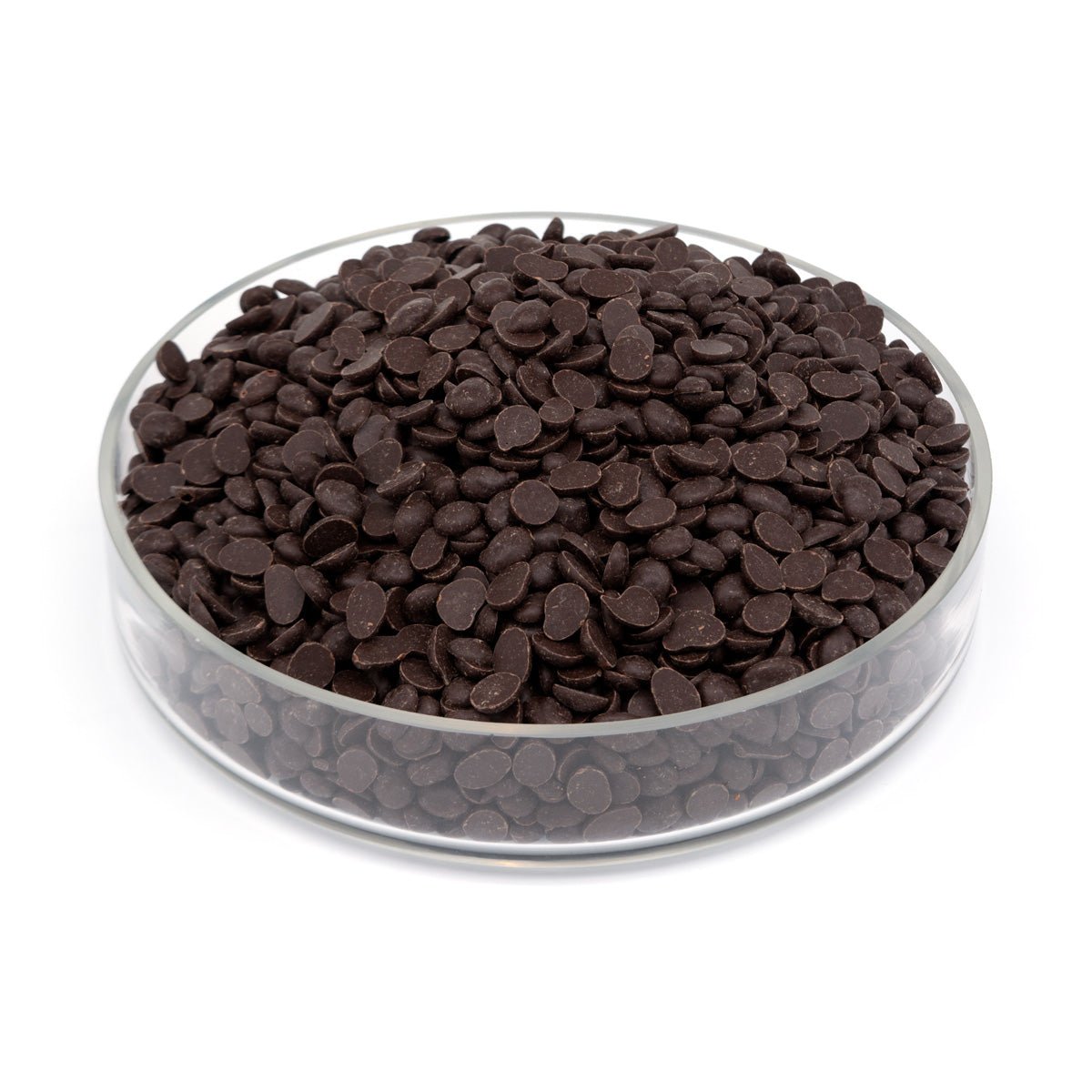 Clear glass bowl filled with dark chocolate chips on a white background