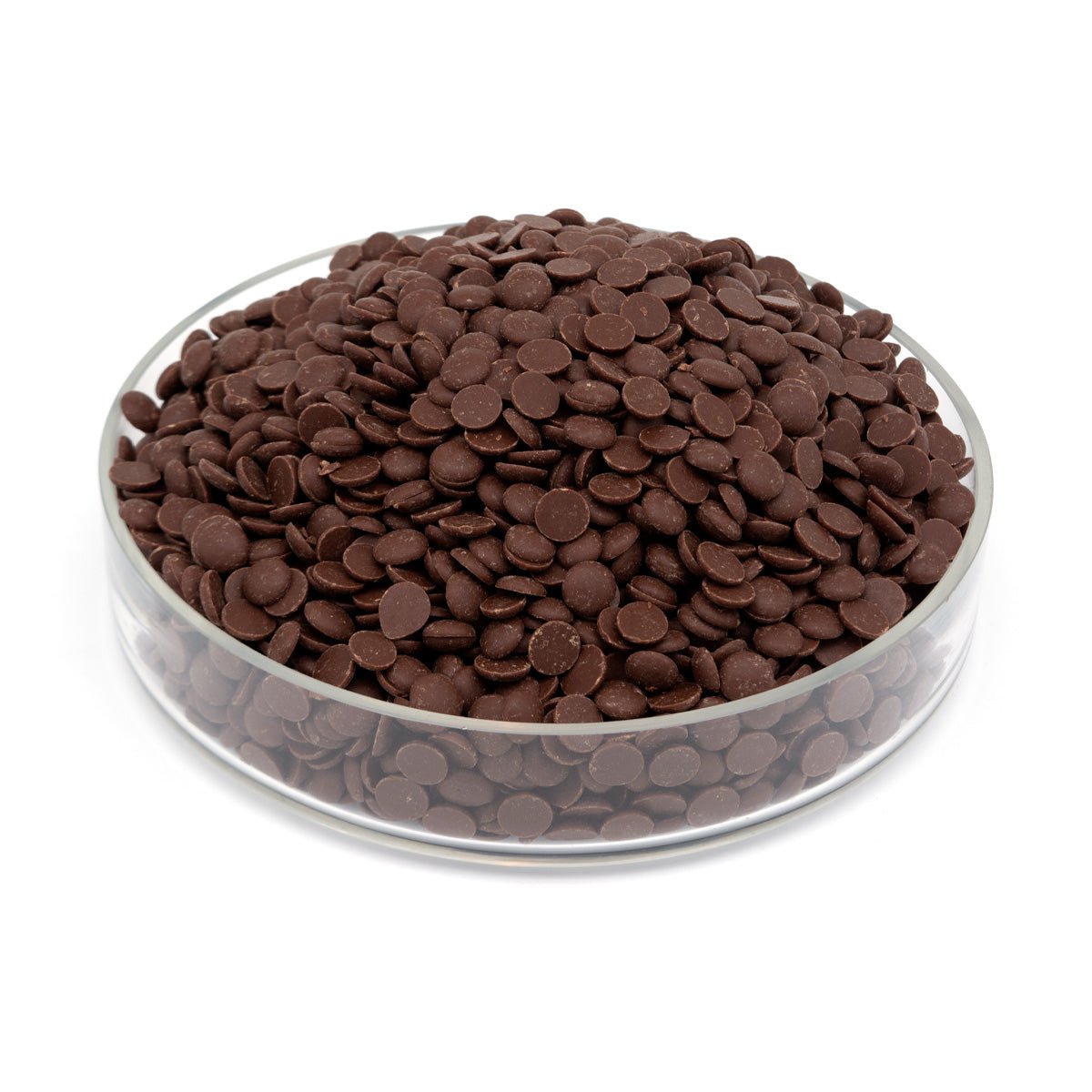 Glass bowl filled with chocolate drops on a white background