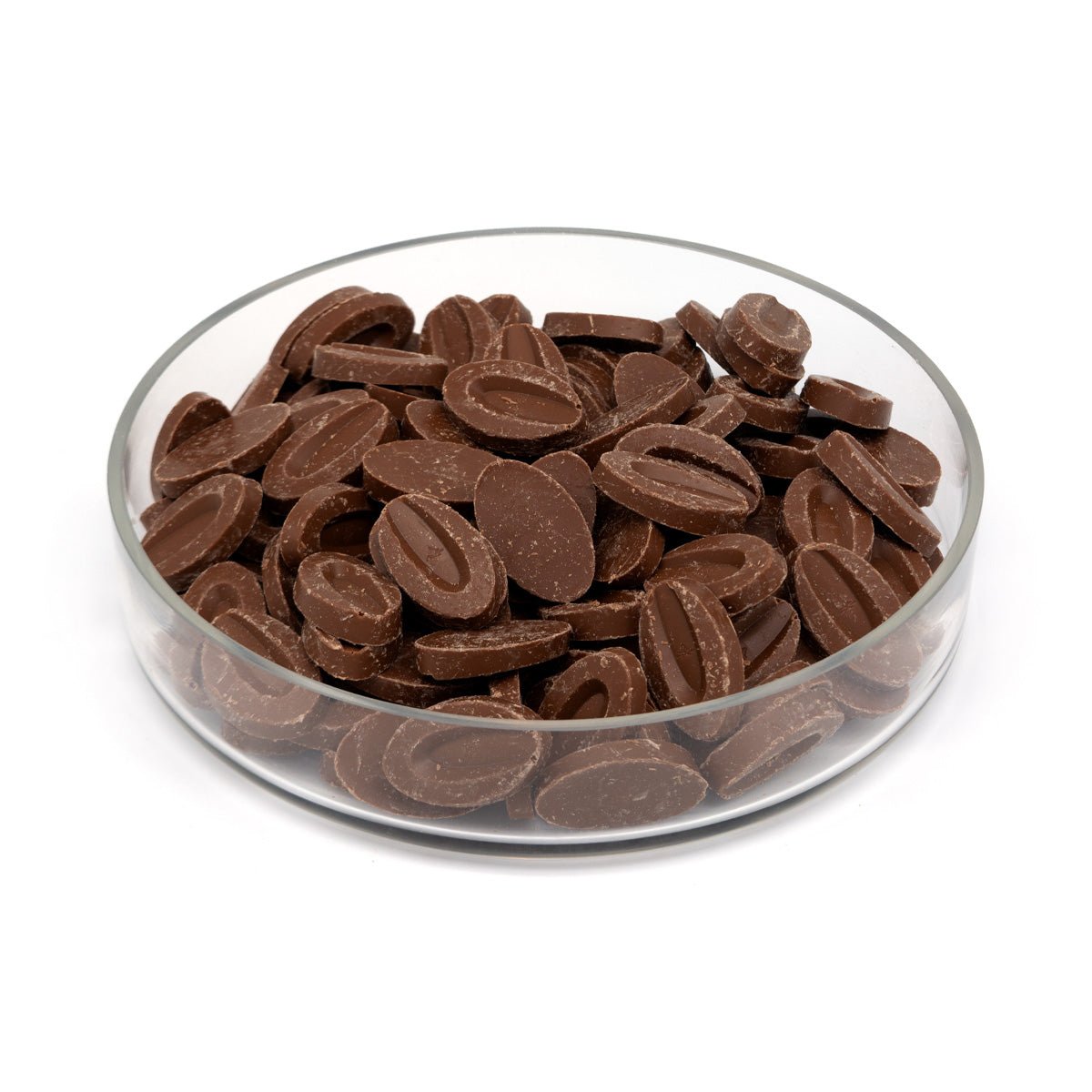 Glass bowl filled with chocolate candies on a white background