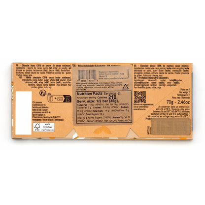 Close-up of a chocolate bar packaging with nutritional information on a white background