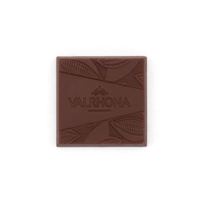 Square piece of Valrhona chocolate on a white background