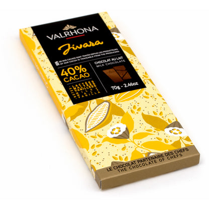 A Valrhona Jivara 40% cacao milk chocolate bar in its original packaging, featuring a yellow and brown floral pattern with a black label at the top.