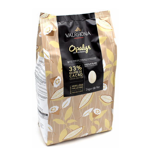 A 3 kg bag of Valrhona Opalys 33% cocoa butter chocolate blanc, featuring a beige and gold patterned design with a black central label.