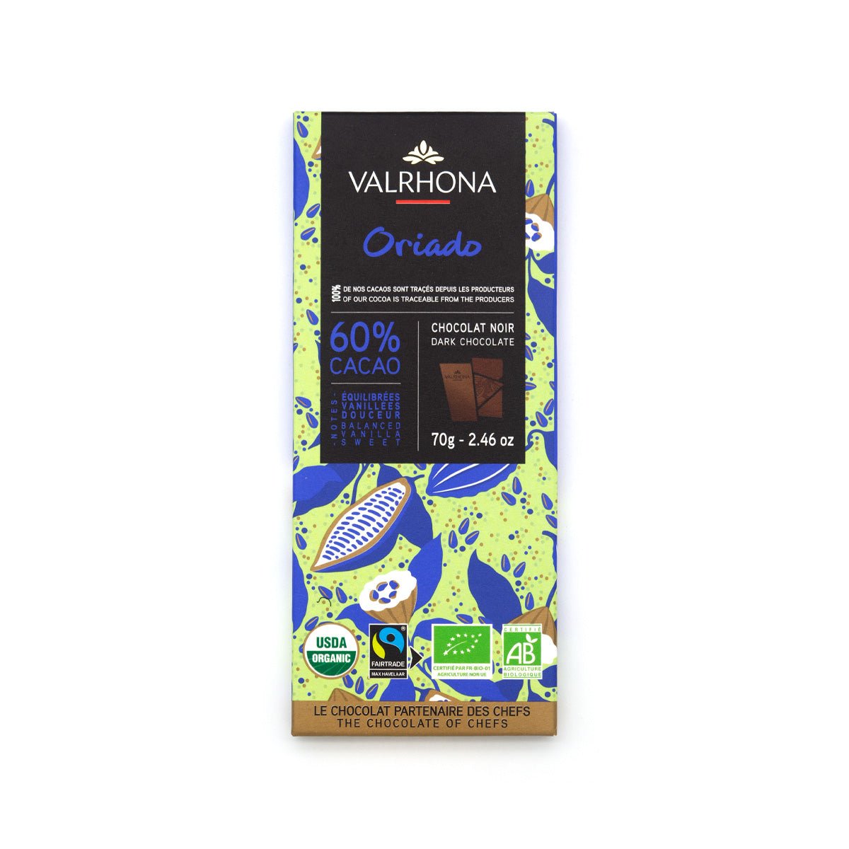 A Valrhona Oriado 60% cacao dark chocolate bar in its retail packaging, featuring a black top section with the brand name and blue 'Oriado' text, set against a lime green and blue botanical patterned wrapper.