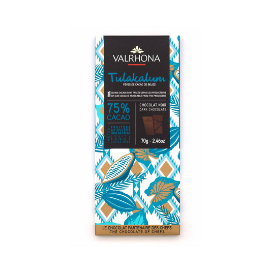 A Valrhona Tulakalim 75% cacao dark chocolate bar in a decorative paper wrapper with teal, gold, and white botanical patterns and a black central label.